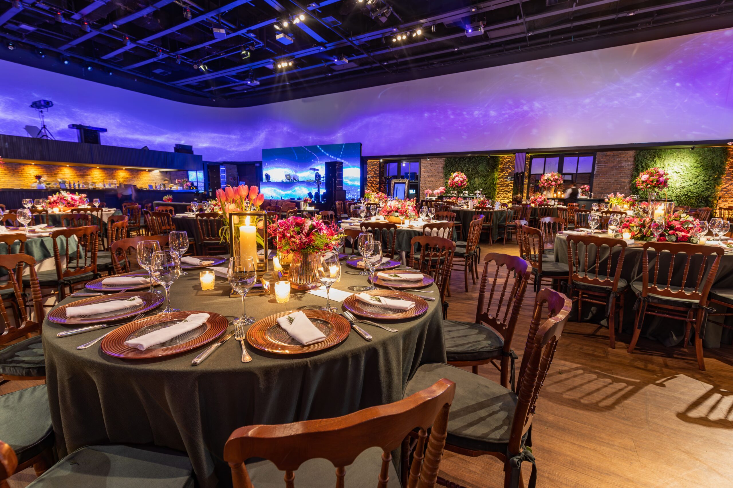 A successful corporate event setup by EVH Events, demonstrating flawless lighting and stage production resulting from careful event venue selection.